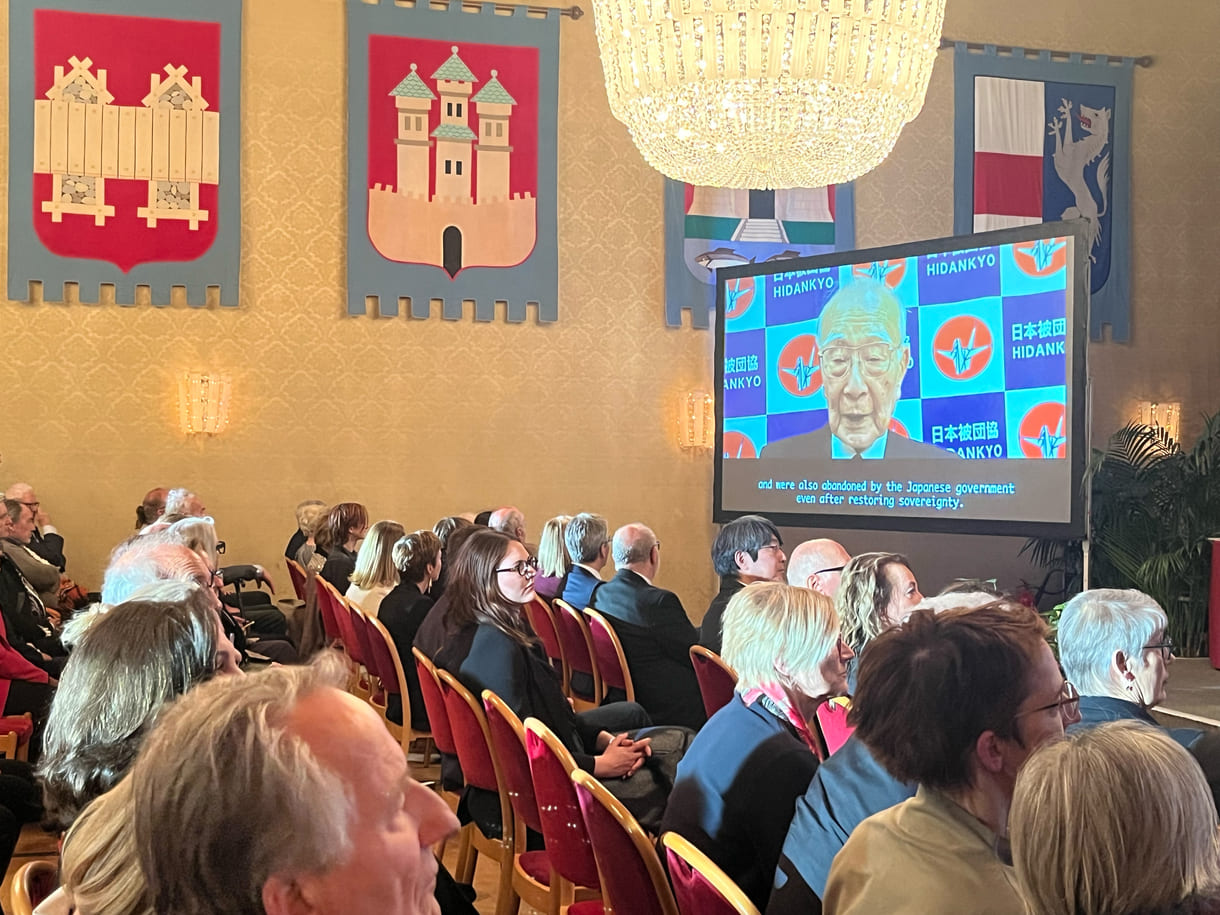 Als Keynote wurde ein Video der Dankesrede von Terumi Tanaka anlässlich des Friedensnobelpreises 2024 an die Organisation Nihon Hidankyo (Überlebende der Atombombenabwürfe auf Hirsohima und Nagasaki 1945) eingespielt; Die Organisation stzt sich für nukleare Abrüstung ein.